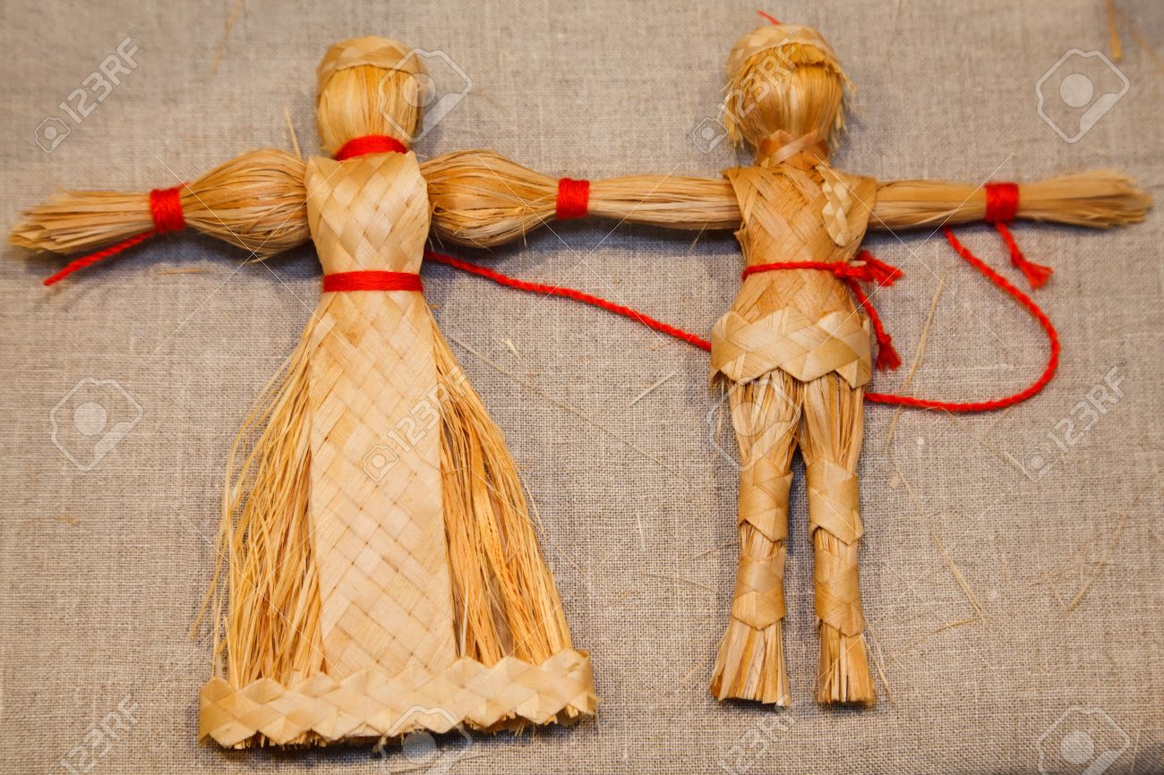 12509349-Two-dolls-weaved-from-straw-Russian-national-souvenir--Stock-Photo